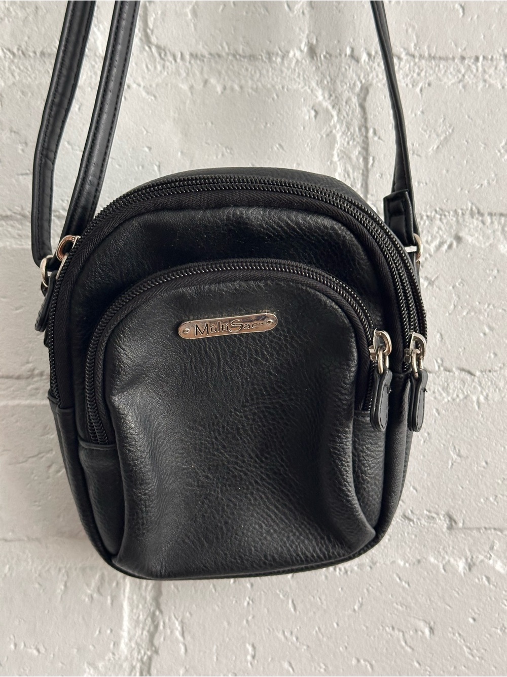 MultiSac black leather crossbody bag with multiple pockets